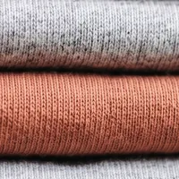 Rust colored cotton jersey, close up.